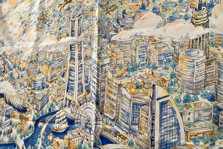 Une écharpe ornée d'un motif de style croquis représentant le paysage urbain de Minato Mirai vu du ciel.
